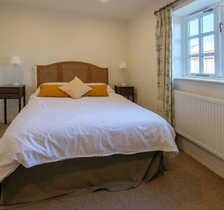 Shalfleet Barn Master bedroom complete with bed side tables and wardrobe